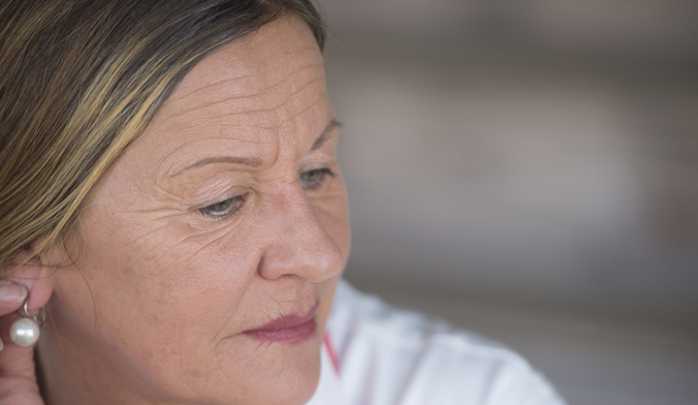 shutterstock_258669863_woman_menopause_sad